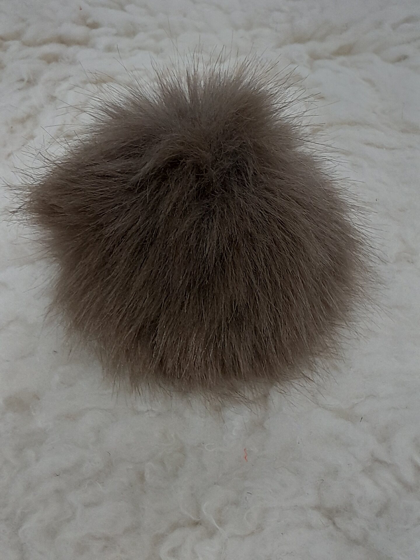 Muhkea tupsu 12cm Ruskea